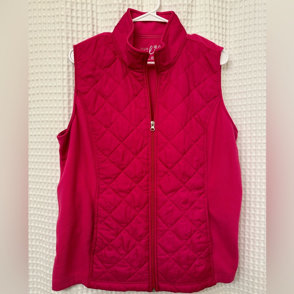 Magenta colored zip up vest